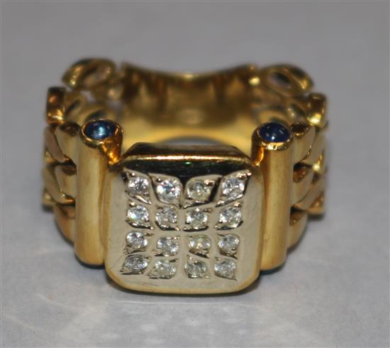 A diamond and cabochon sapphire ring, 800 standard yellow gold setting with articulated shank size P.